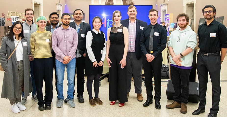 Photo of the 2023 Art of Research winners. The Art of Research event was held at the Buffalo Museum of Science in April 2023. The Art of Research was a competition organized by the Graduate School to celebrate the research of UB graduate and postdoctoral scholars through a showcase of original images showing the beauty of research, scholarship, and creative activity. The event featured 28 finalized and awards were presented to winners. Photographer: Meredith Forrest Kulwicki. 