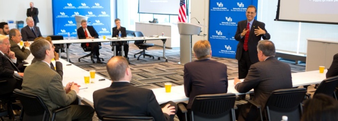 Photo of President Satish Tripathi speaking in a meeting room. 