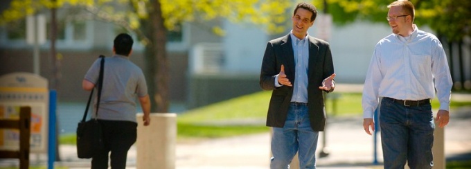 Staff walking on campus. 