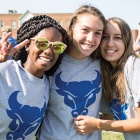 three smiling students. 