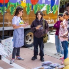 Students learning about fresh vegetables at the Veggie Van on UB's North Campus. 