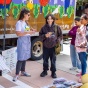 Students learning about fresh vegetables at the Veggie Van on UB's North Campus. 