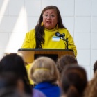 A speaker addressing a crowd of attendees at the celebration of UB's new Indigenous Studies department. 