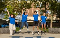 Students helping with Governors Complex move in mping in the air. 