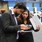 Students reviewing their resumes at the STEAM job + Internship Fair. 