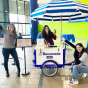 Odoo reps posing around our Resumade pop-up trike. 