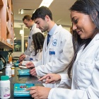 students counting pills. 