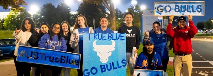 students participating in chalking True Blue spirit on campus. 