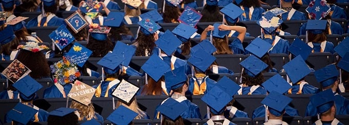 Graduation cap designs at the College of Arts and Sciences (CAS) Afternoon Commencement 2018 in Alumni Arena. 