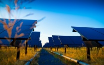 sun shining on solar panels. 