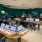 IT staff with masks on prepare 200 laptops in Silverman Library in Capen Hall. 