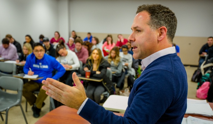 Michael Stefanone teaching a political communications course in Clemens Hall. 